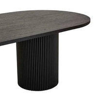 Benjamin Ripple Oval Dining Table in matt black with rippled oval top and cylindrical pillar base
