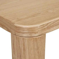 Close-up of GlobeWest Frankie Dining Table corner in natural ash veneer with rounded edges and sturdy chubby leg.