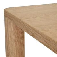 Close-up of GlobeWest Frankie Dining Table corner in natural ash veneer with chubby legs and smooth timber finish