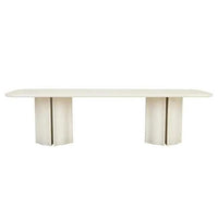 GlobeWest Leon Dining Table in porcelain with sculptural form, rounded corners, and bold fluted pillar legs.