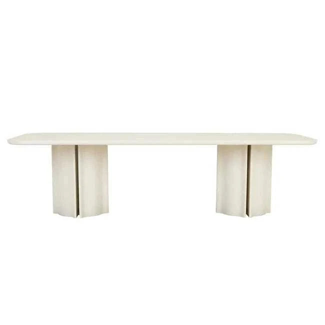 GlobeWest Leon Dining Table in porcelain with sculptural form, rounded corners, and bold fluted pillar legs.