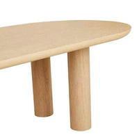 GlobeWest Seb Oval Four Leg Dining Table in natural oak veneer with rounded demi bullnose edges and solid cylindrical legs