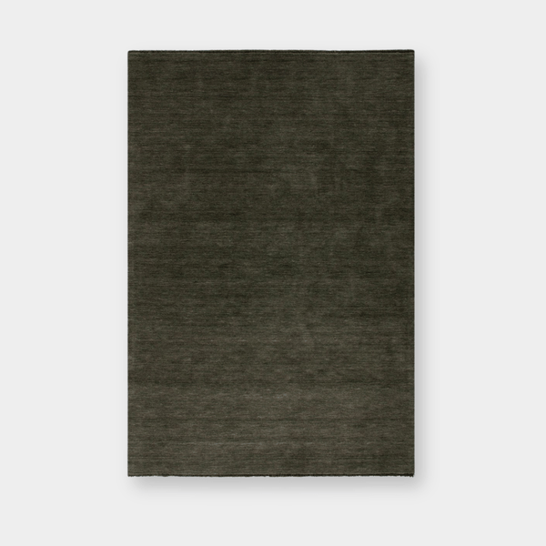 Sandringham Floor Rug in forest green with dense wool pile and subtle fringing, handknotted luxury design.