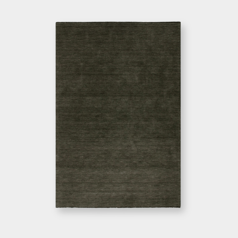 Sandringham Floor Rug in forest green with dense wool pile and subtle fringing, handknotted luxury design.