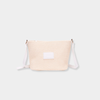 Base Supply Panier crossbody bag in chalk with woven straw texture and adjustable strap