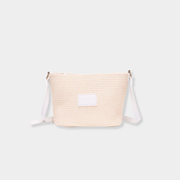 Base Supply Panier crossbody bag in chalk with woven straw texture and adjustable strap
