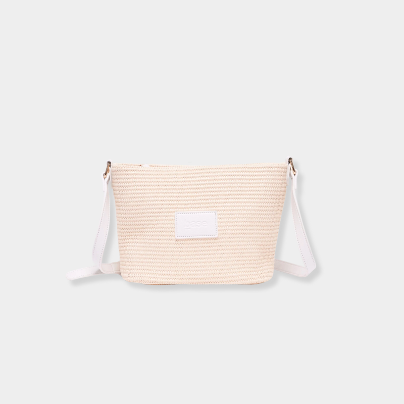 Base Supply Panier crossbody bag in chalk with woven straw texture and adjustable strap