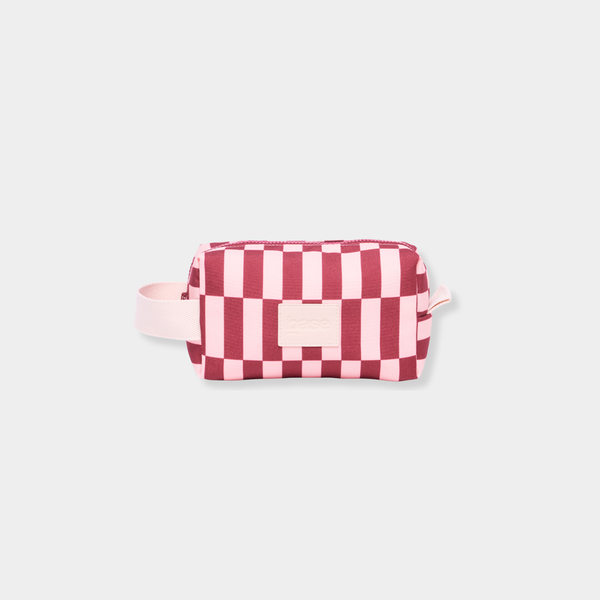 Base Supply Ditty compact midi travel bag in burgundy and peony check with water-resistant fabric and cotton carry loop