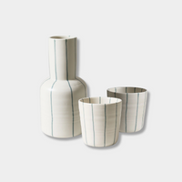 Robert Gordon Coastal Junction cream stoneware carafe set with green stripes, including one carafe and two cups.