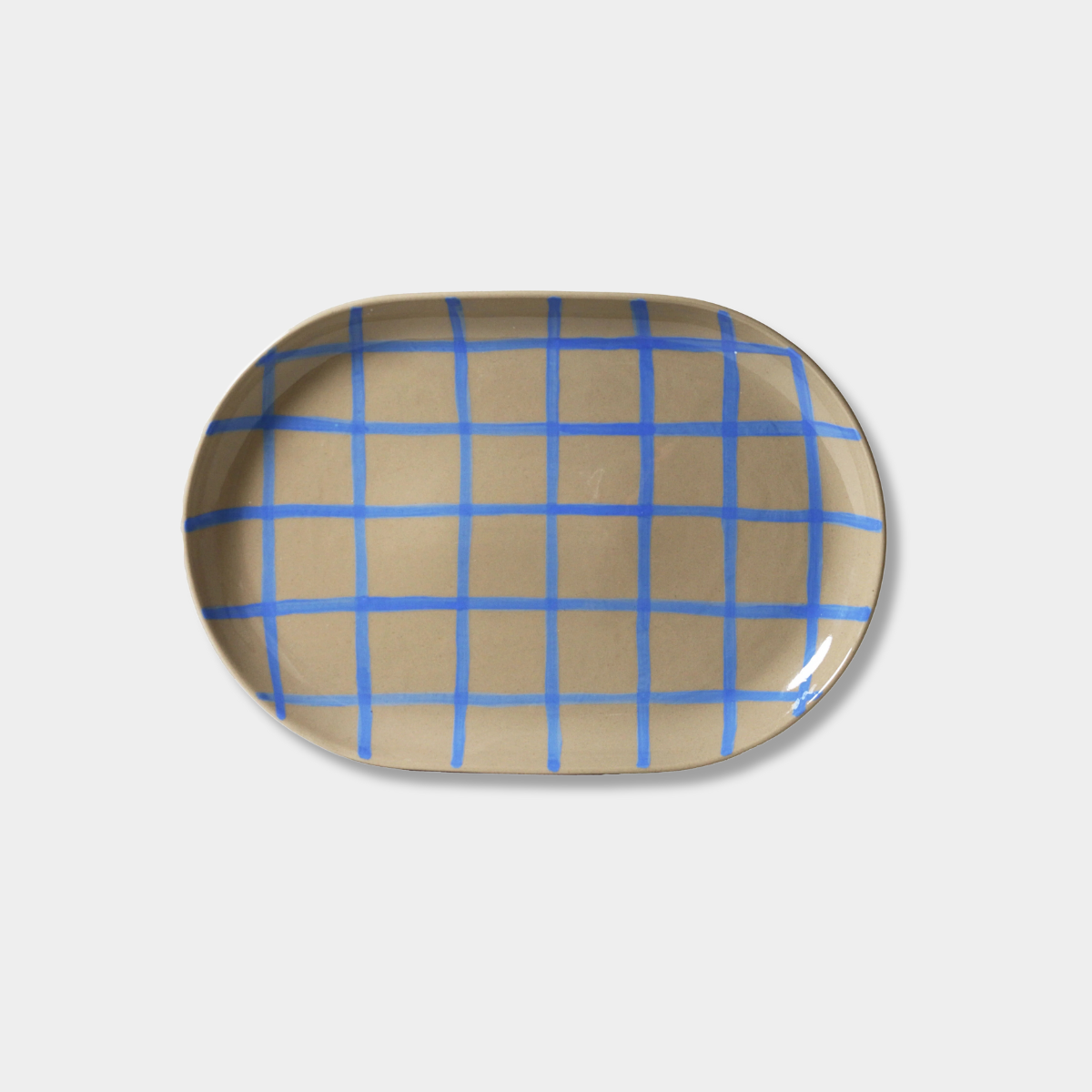 Robert Gordon Coastal Junction 38cm oval stoneware tray with blue handbrush grid design