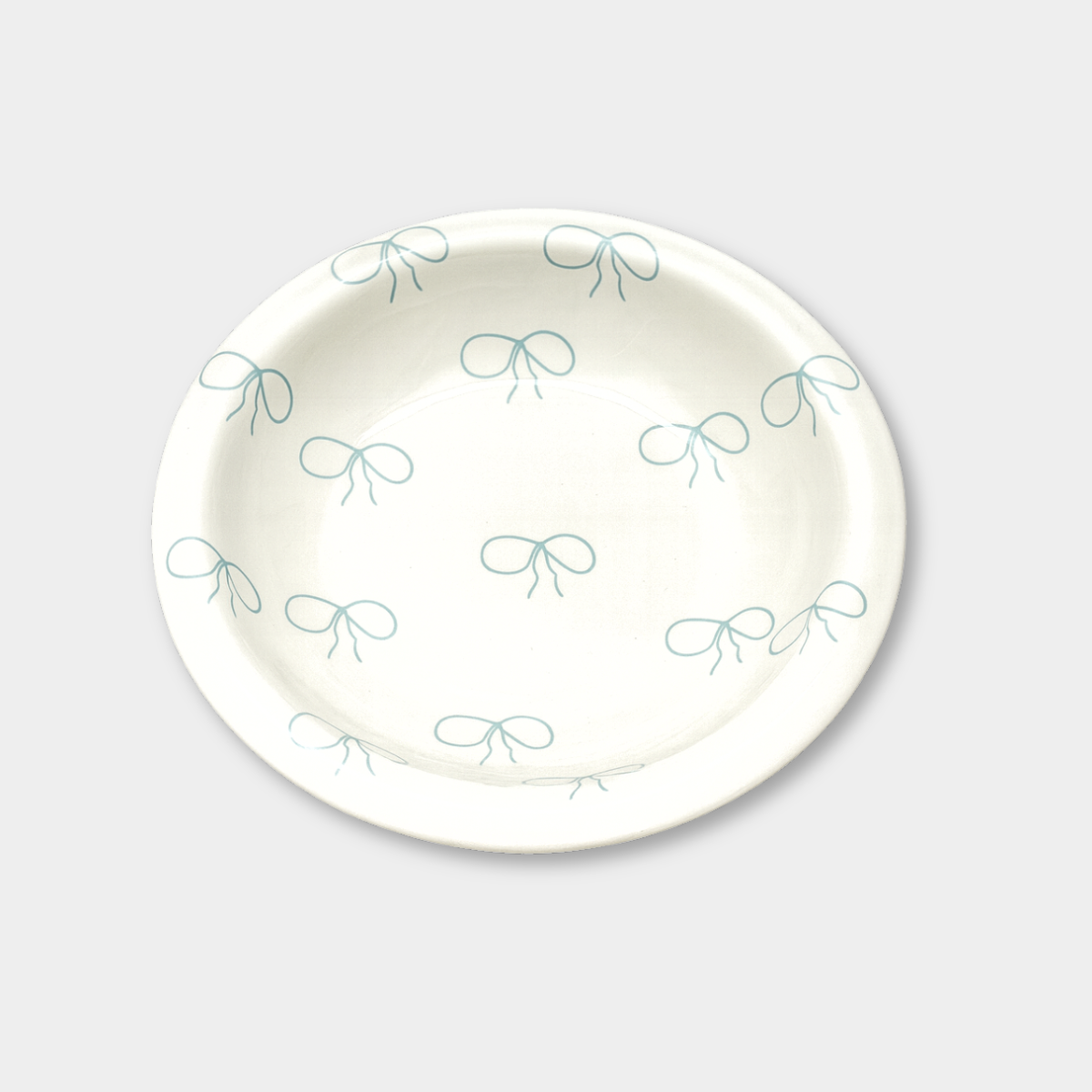 norsu STUDIO Small Bow Bowl white ceramic with blue bow pattern and smooth gloss finish