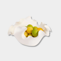 Heather Decorative Bowl in white ceramic with sculptural, organic shape holding citrus fruits, 33cm diameter.