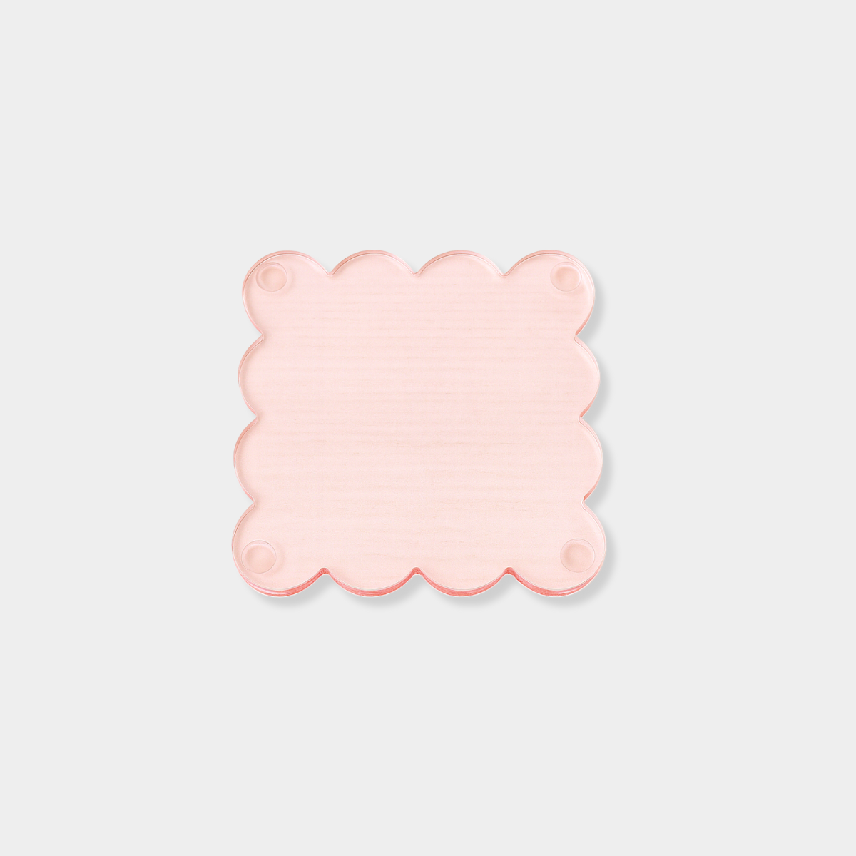 Set of four translucent ochre norsu Studio Perspex scallop coasters with signature scalloped edges