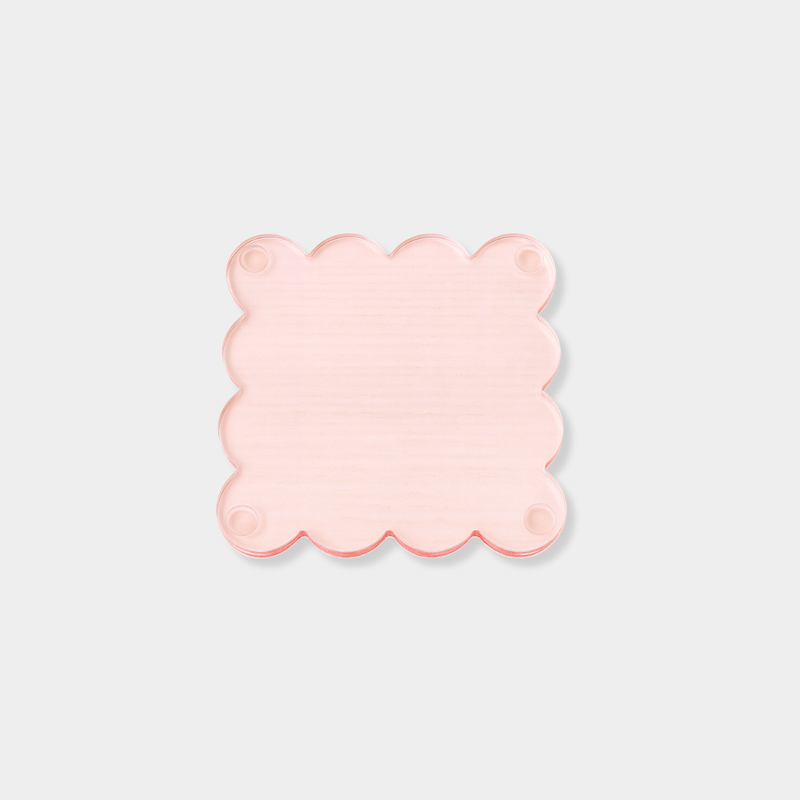 Set of four translucent ochre norsu Studio Perspex scallop coasters with signature scalloped edges