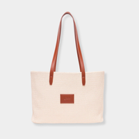 Base Supply Panier tan woven basket bag with leather straps and cotton lining