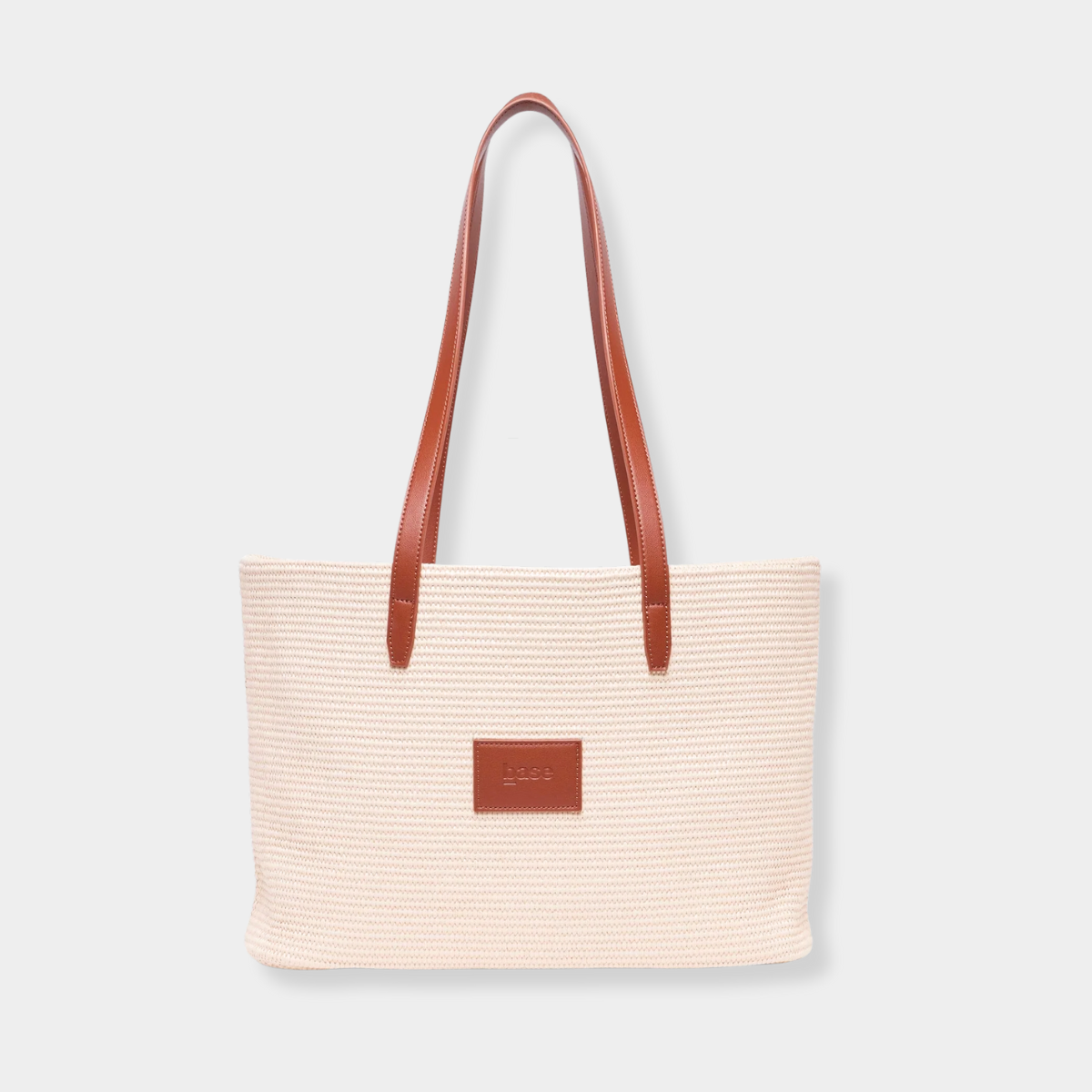 Base Supply Panier tan woven basket bag with leather straps and cotton lining