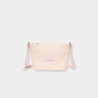 Pink woven Base Supply Panier Crossbody bag with adjustable strap and zip-top closure