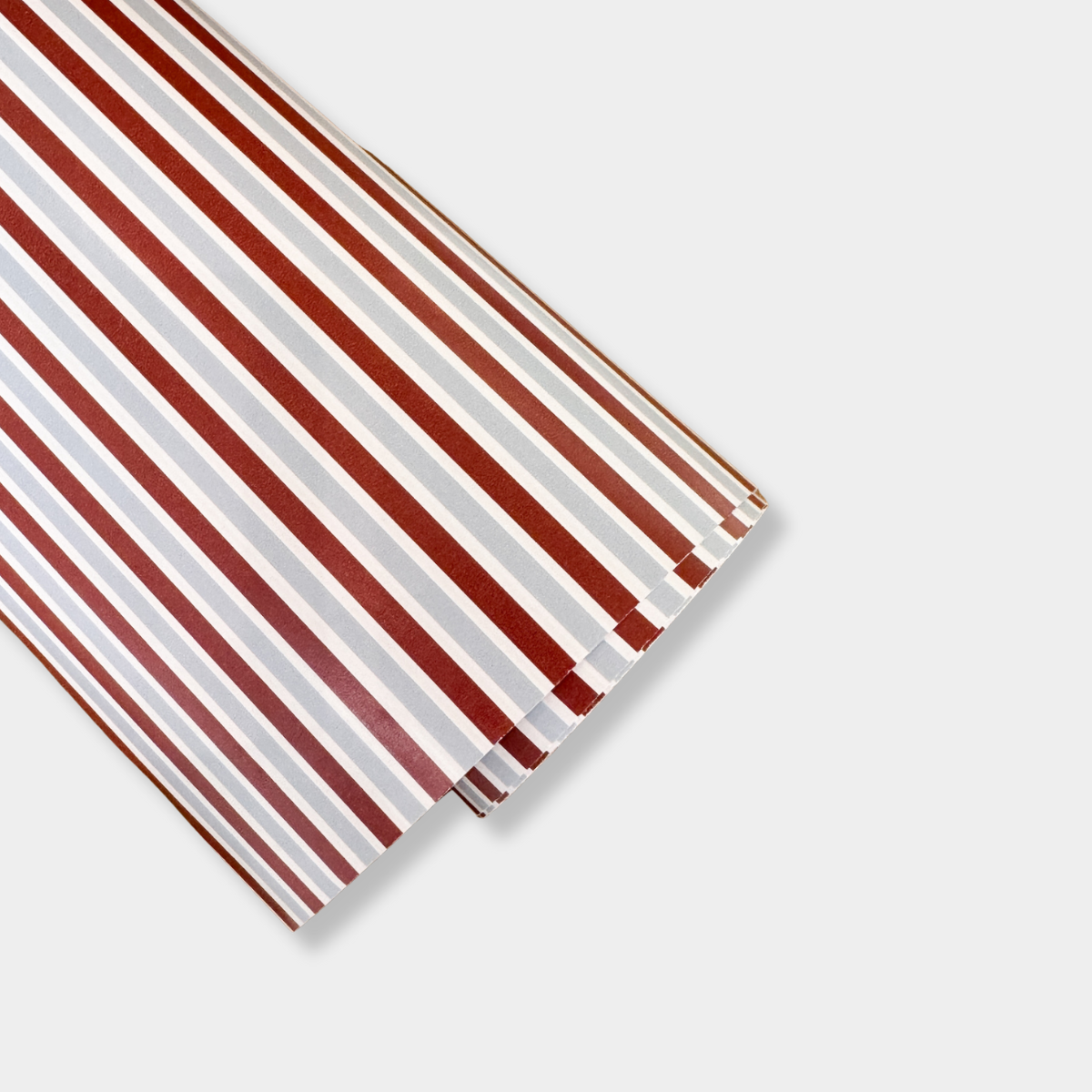norsu Studio Christmas Wrapping Paper jumbo roll with red, white, and brown stripe design