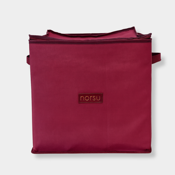 norsu Studio Christmas ornament storage box in burgundy woven fabric with gold branding and zip detailing, holds 64 decorations