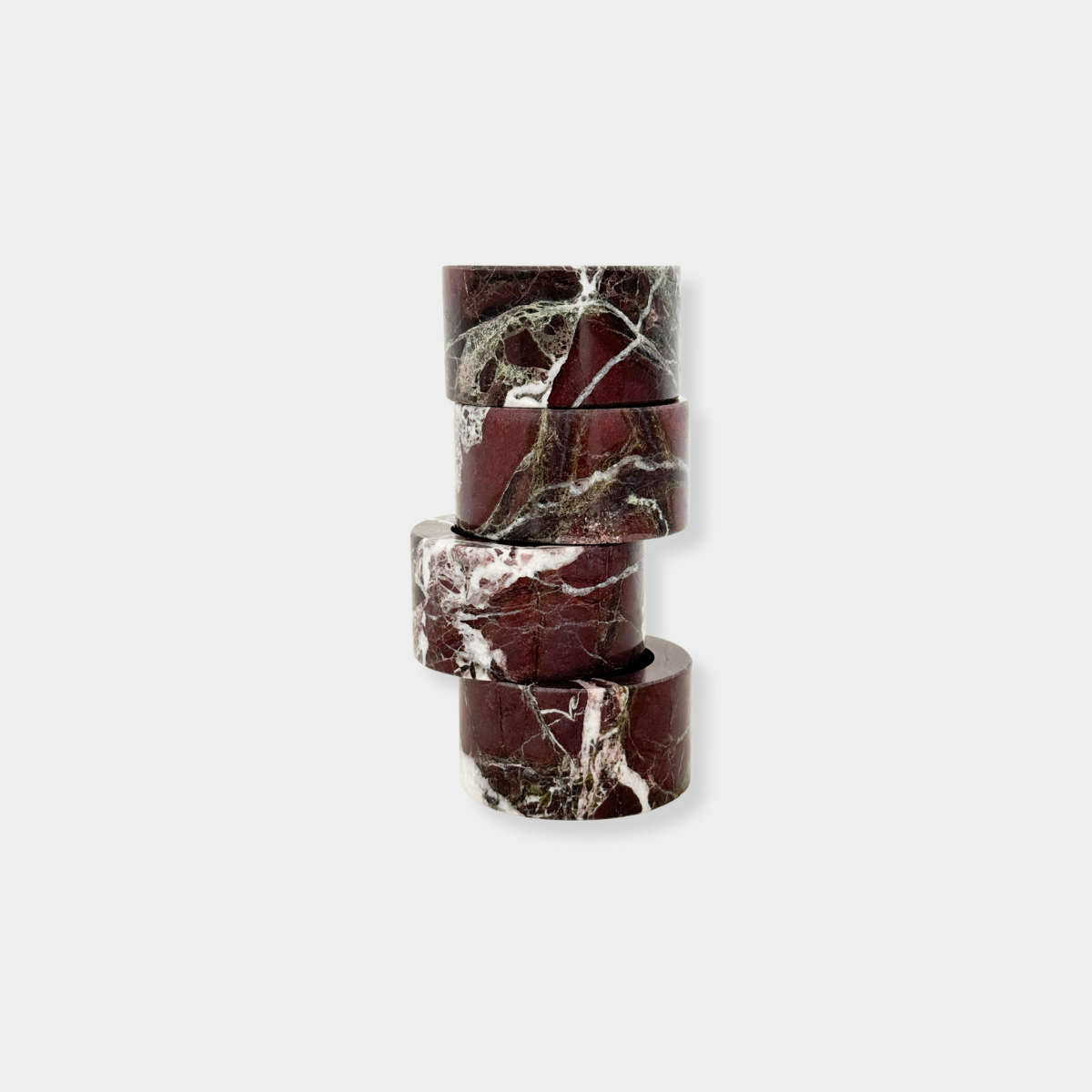 Set of 4 norsu STUDIO Rosso Levanto marble circular napkin rings in deep burgundy with natural white veining