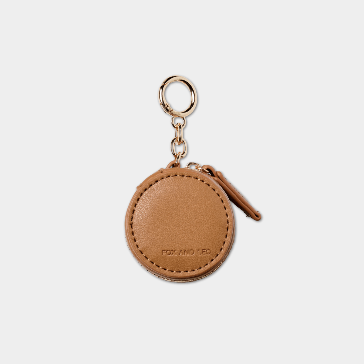 Fox and Leo Eye Catcher Bag Charm in tan leather with gold hardware and microfibre cleaning cloth.