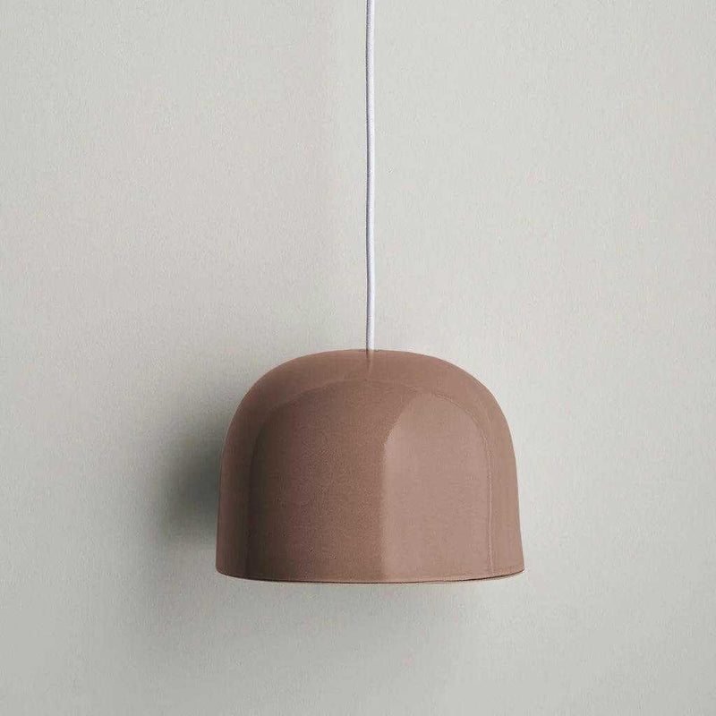 norsu x Robert Gordon Bell Light pendant in dusty rose ceramic with dome shape and hidden cord suspension