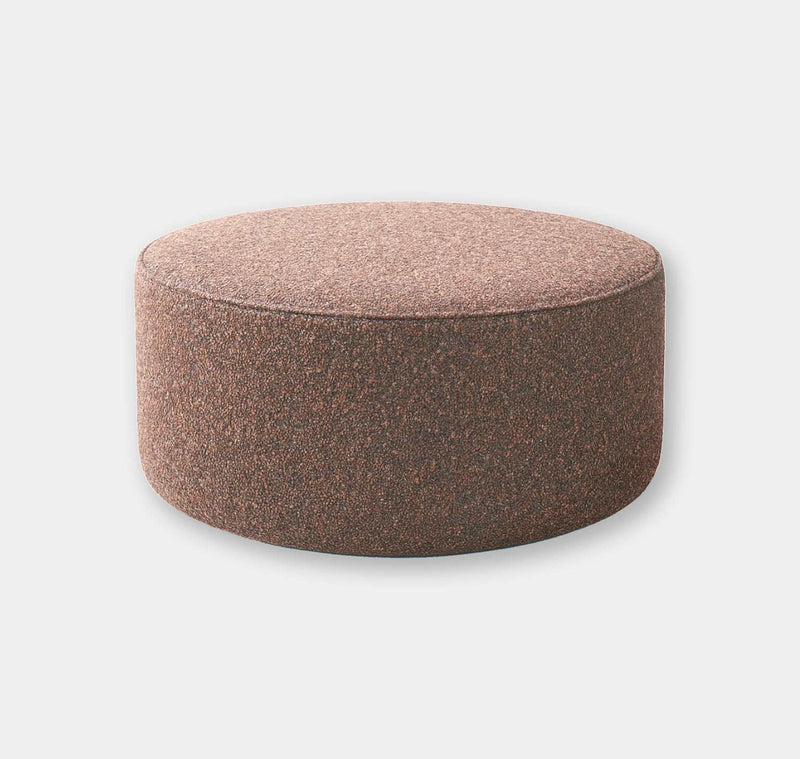 Elysian Bouclé Ottoman in blush pink textured fabric, round handcrafted footrest and coffee table alternative.