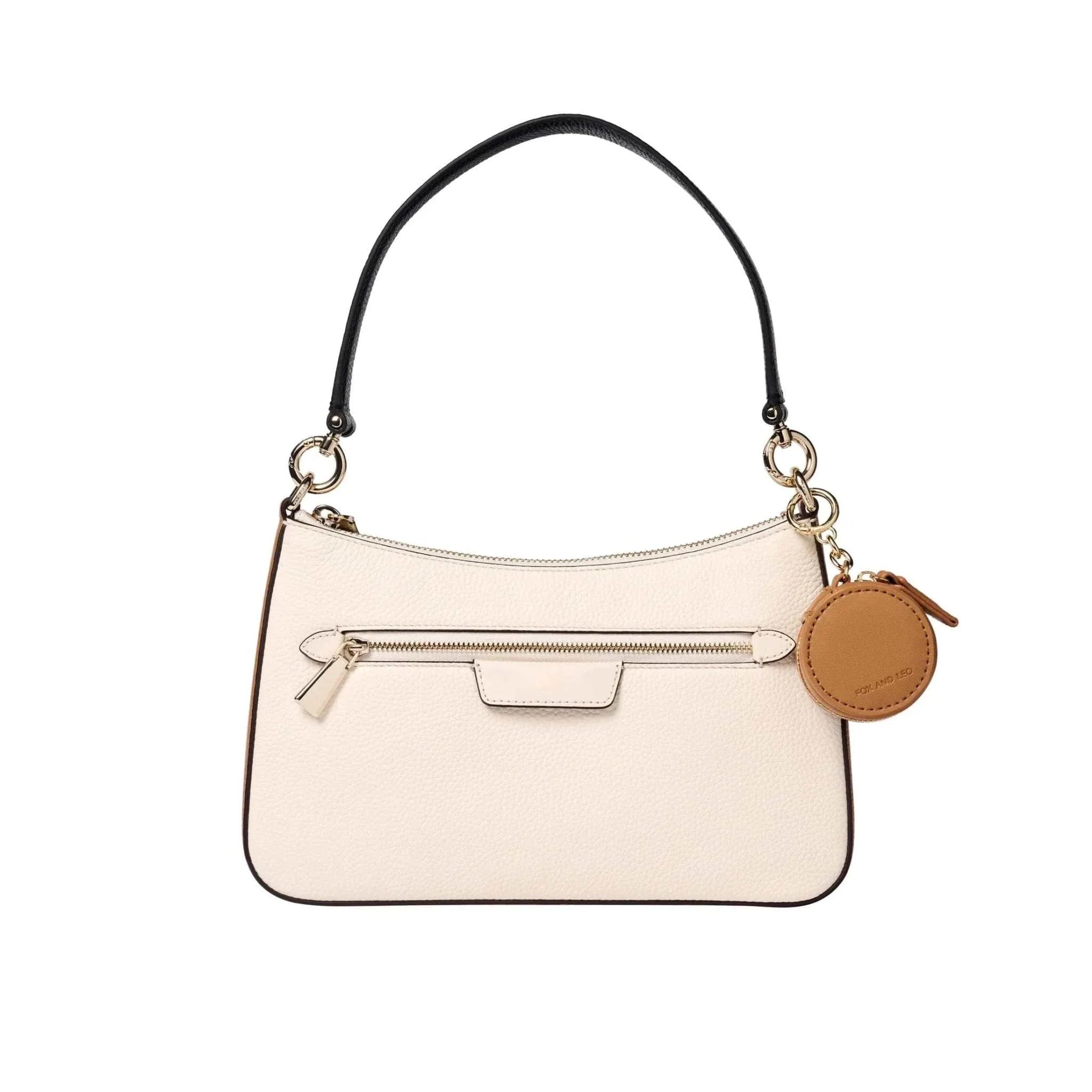 Tan Fox and Leo Eye Catcher Bag Charm with microfibre cleaning cloth clipped to cream handbag