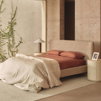 Dalia King Bed Mocha styled in a bedroom