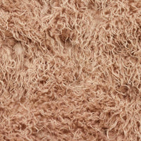 Brown faux fur upholstery close-up