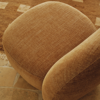 Liora Swivel Chair Oat in a reading corner