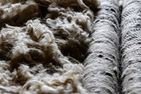 Hand-loomed Vogel Rug in ginger tones with soft wool pile and linear border design