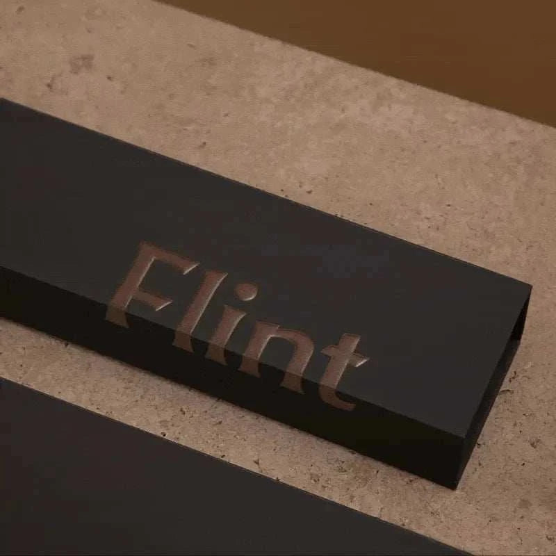 Gunmetal Flint rechargeable lighter with USB-C charging, durable zinc alloy body, and LED battery indicator.