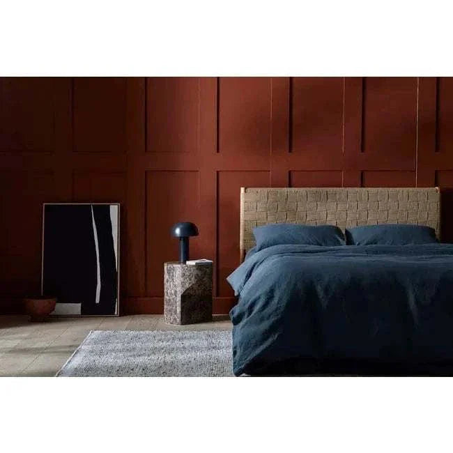 GlobeWest Tepih Maren Rug in stone, hand-woven 100% wool rug with textured design in a modern bedroom setting