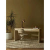 GlobeWest Tepih Maren Rug in stone color under a modern desk and chair in a minimalist room