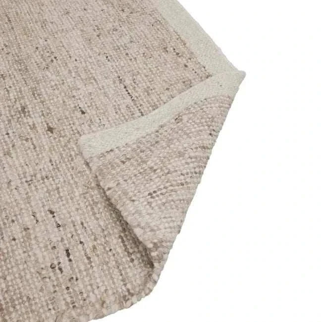 GlobeWest Tepih Maren Rug in stone color, hand woven 100% wool indoor rug with textured design and subtle color variations.