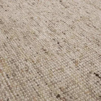 Close-up of GlobeWest Tepih Maren Rug in stone color showing hand-woven wool texture