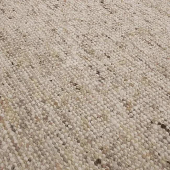 Close-up of GlobeWest Tepih Maren Rug in stone color showing hand-woven wool texture