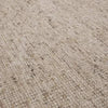 Close-up of GlobeWest Tepih Maren Rug in stone color showing textured hand-woven 100% wool surface