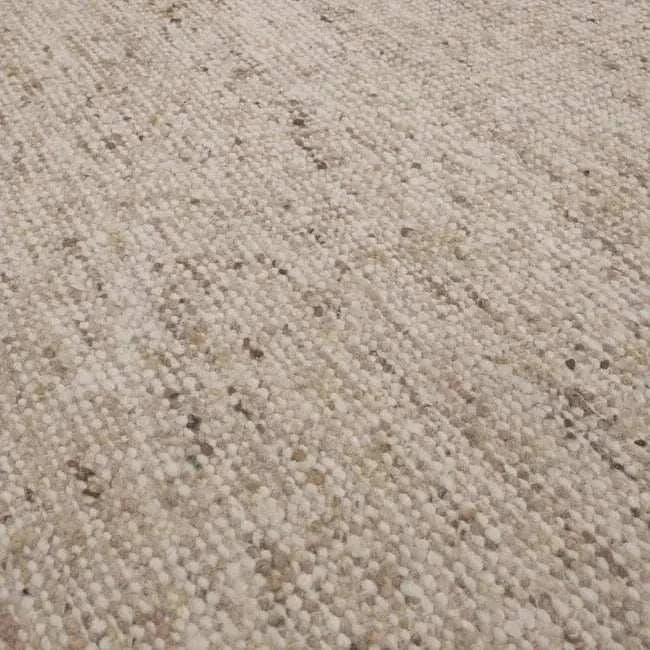 Close-up of GlobeWest Tepih Maren Rug in stone color showing textured hand-woven 100% wool surface