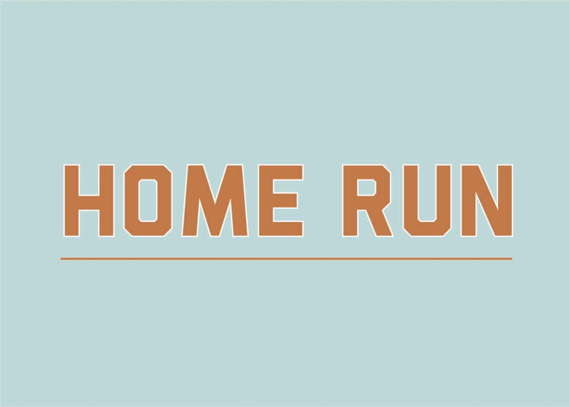 Home Run Print bold text wall art in brown on light blue background from Clubhouse Collection