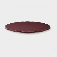 norsu Studio Spin Me Round Lazy Susan in merlot burgundy acrylic with scalloped edge and rotating base available in two sizes