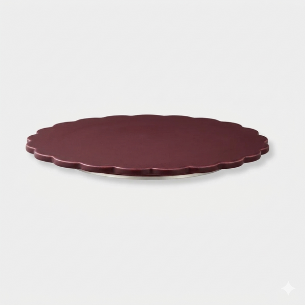 norsu Studio Spin Me Round Lazy Susan in merlot burgundy acrylic with scalloped edge and rotating base available in two sizes
