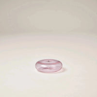 Pink Gentle Habits glass vessel incense holder with a central hole, hand-blown borosilicate glass design.