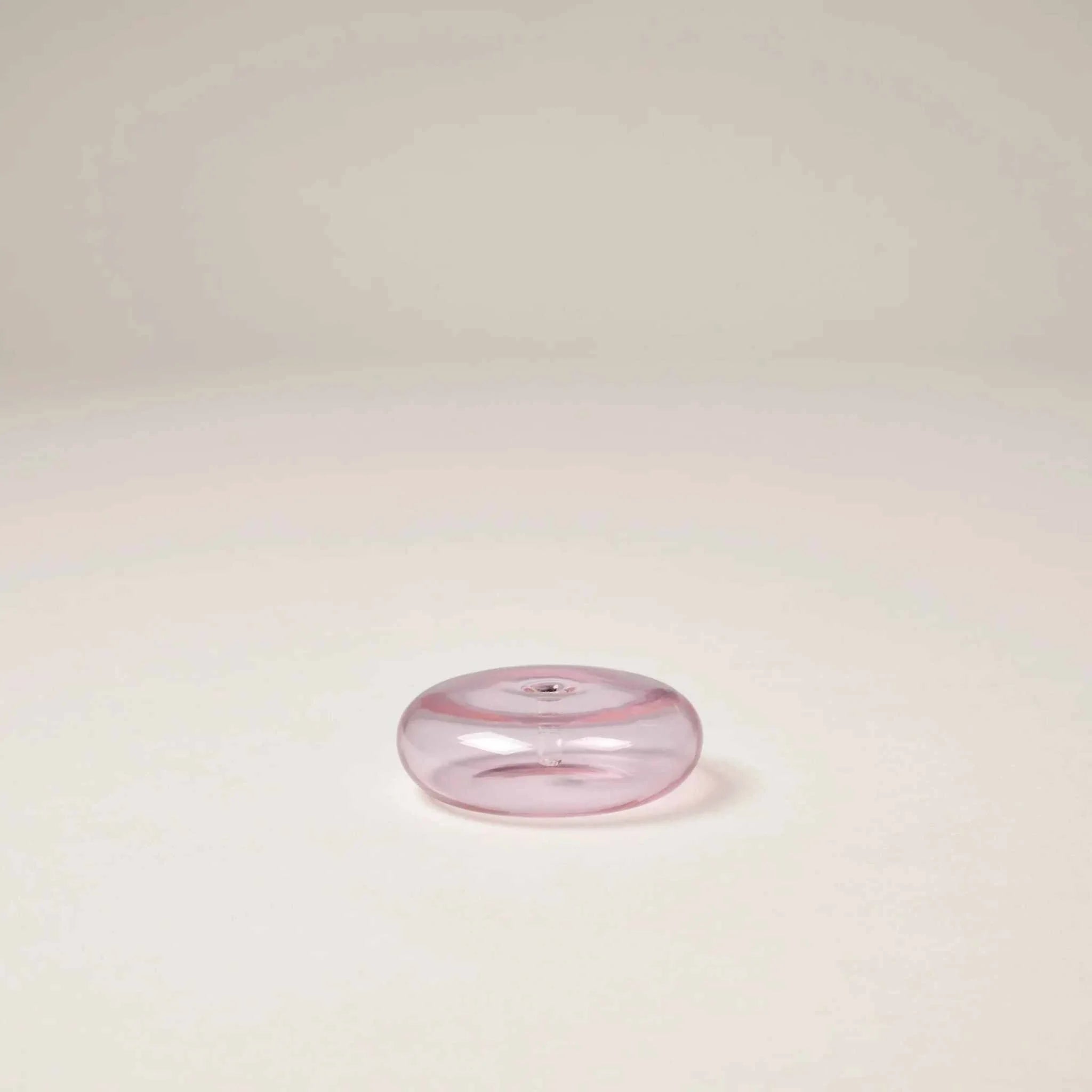 Pink Gentle Habits glass vessel incense holder with a central hole, hand-blown borosilicate glass design.