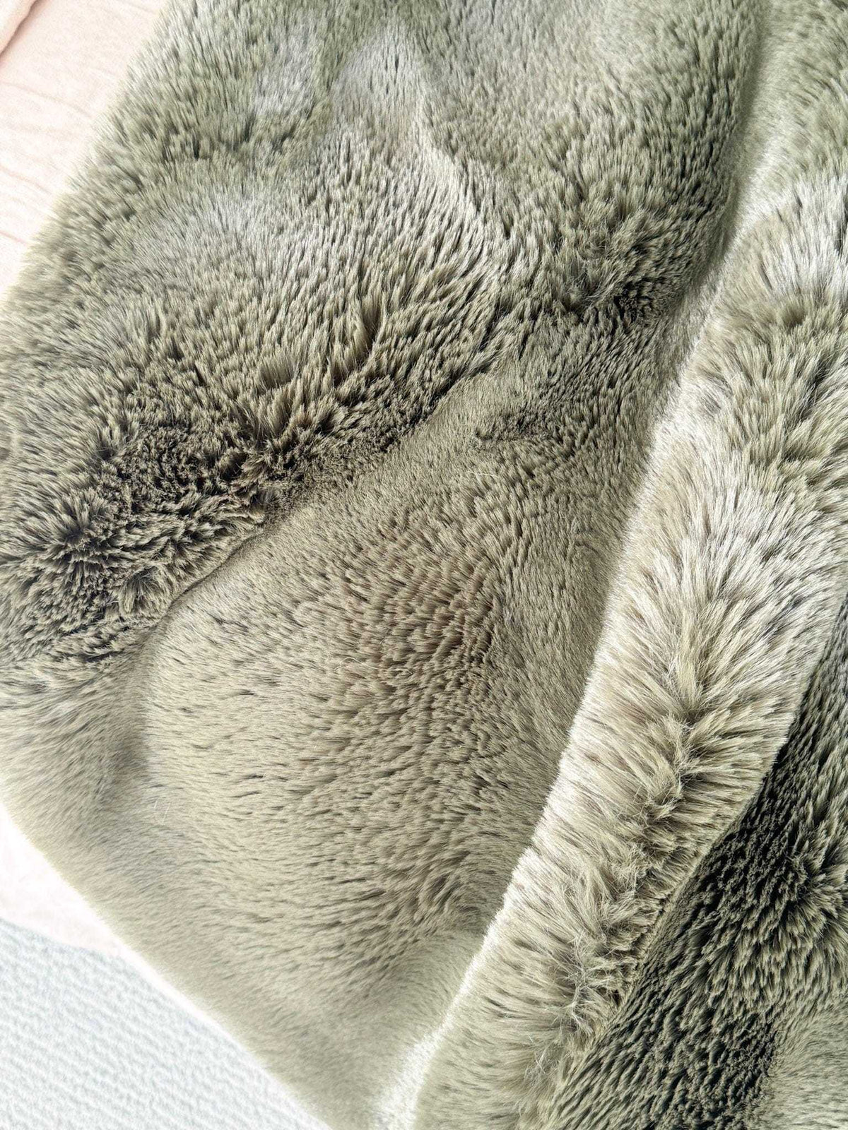 Pelage Faux Fur Throw in seafoam color with dense, soft 30mm pile and faux suede backing