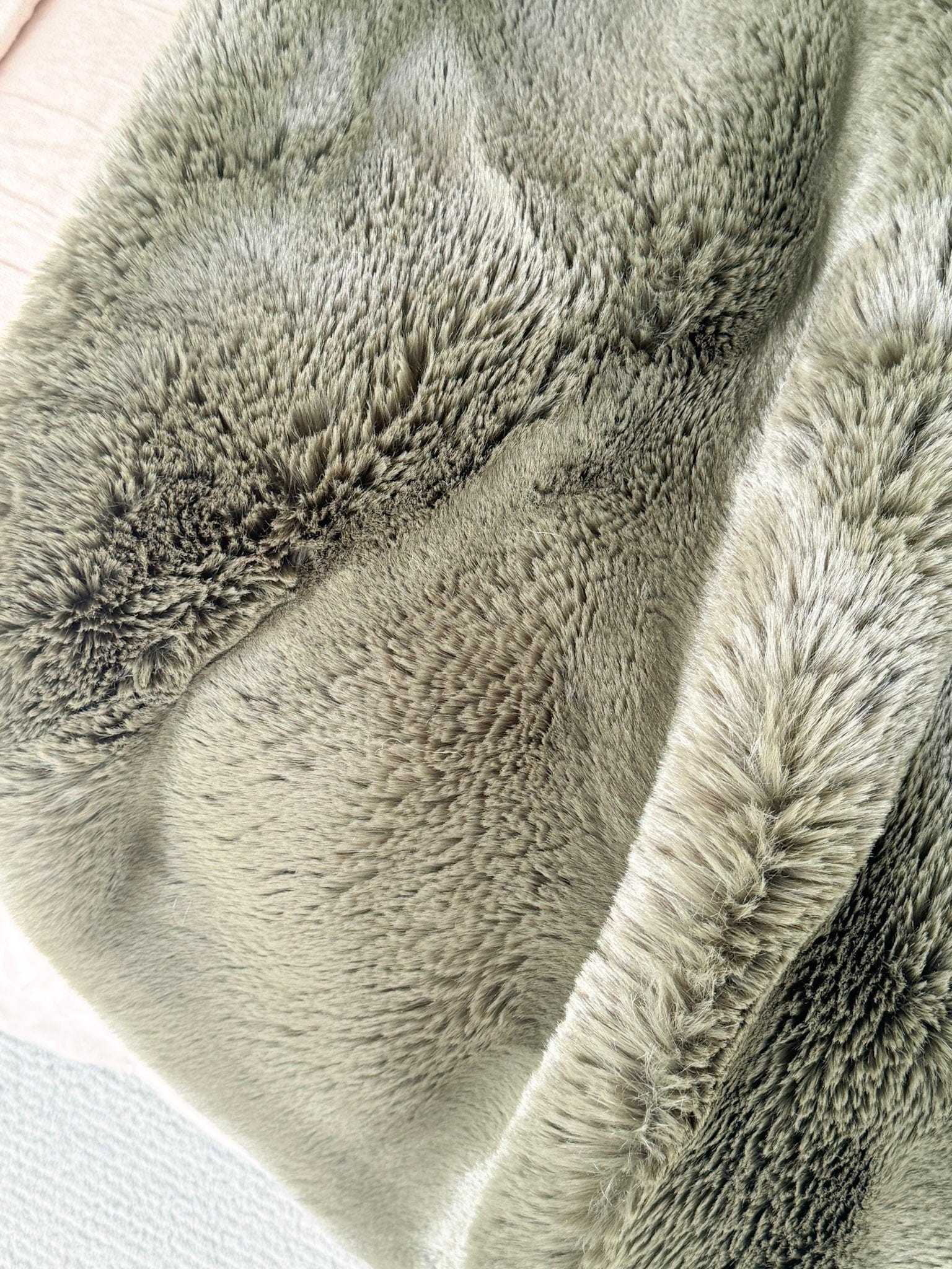 Pelage Faux Fur Throw in seafoam color with dense, soft 30mm pile and faux suede backing