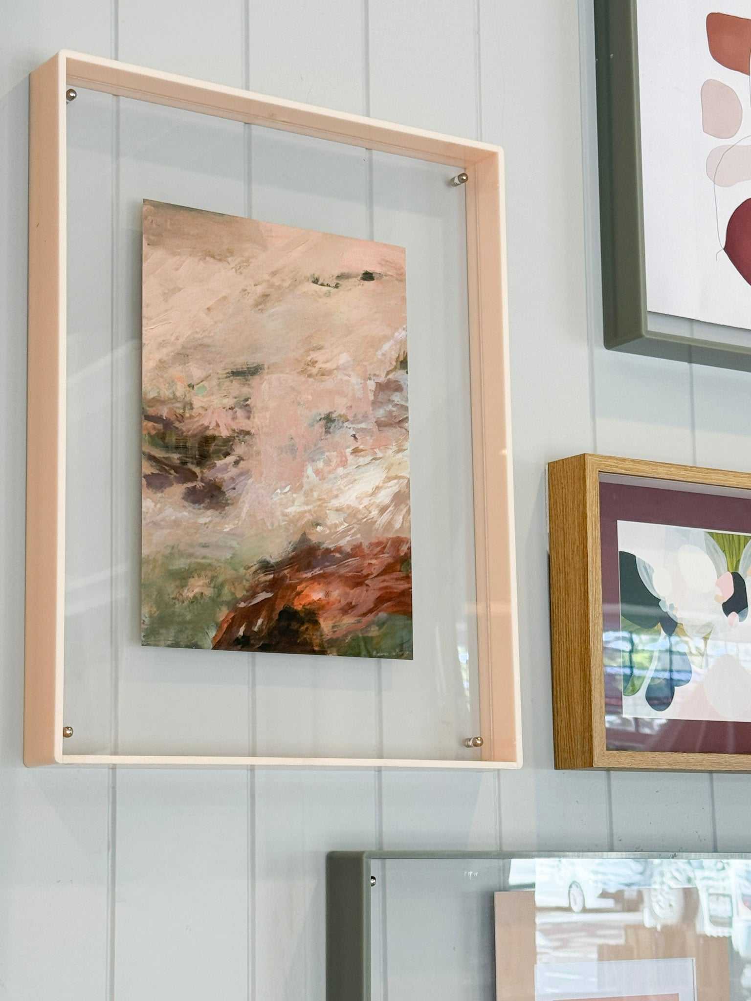 Abstract earth art print "Echoes of Earth" by Prudence De Marchi displayed in wooden frame on wall