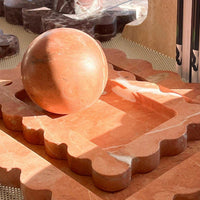 CoTheory Rosso Alicante marble tray with scalloped edges and round incense holder