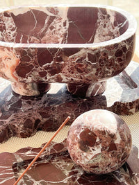 CoTheory Orbit Table Sculpture in Rosso Levanto marble sphere with matching tray and bowl